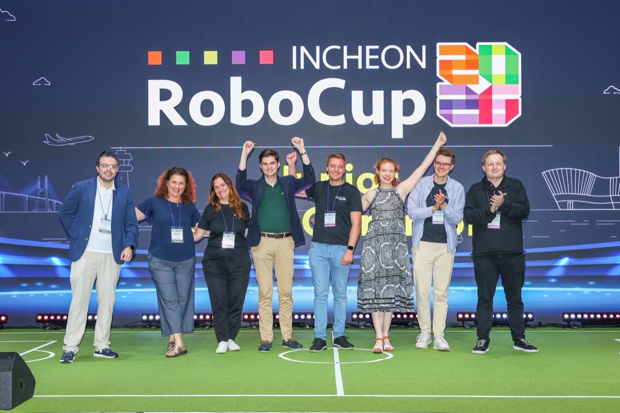 Roberto Bonilla with the RoboCupJunior Executive Committee and Trustees on stage at RoboCup 2026, Incheon